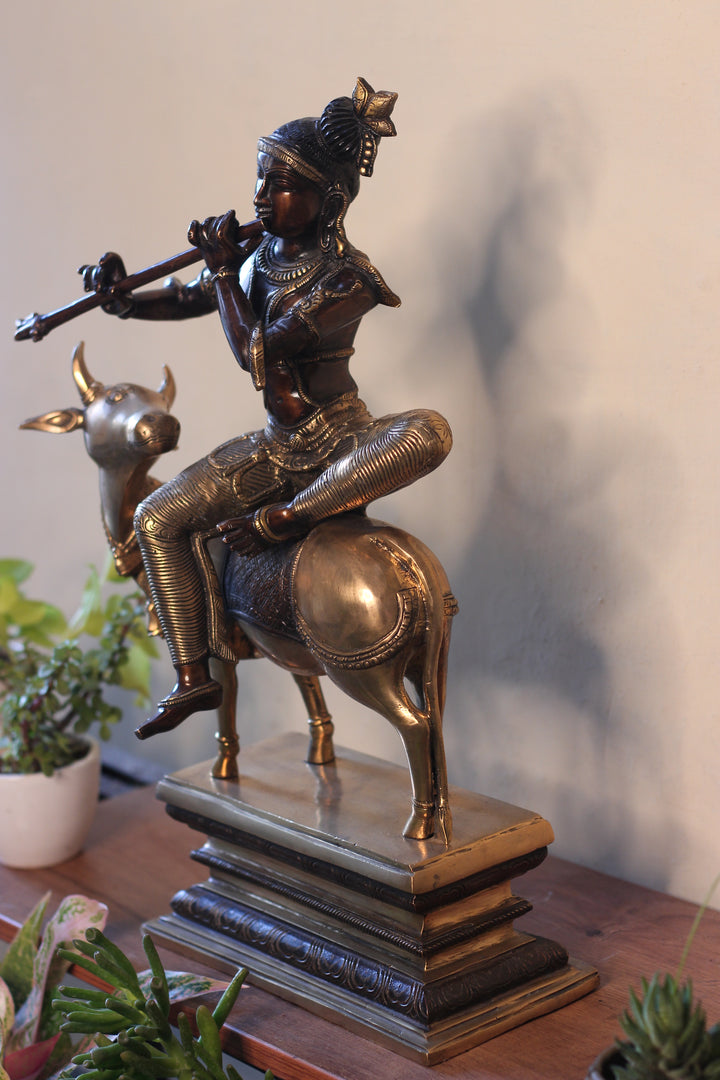 Brass Krishna Sitting On Cow 21”