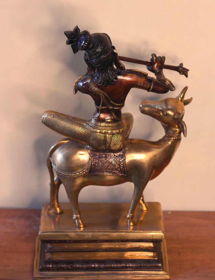 Brass Krishna Sitting On Cow 21”